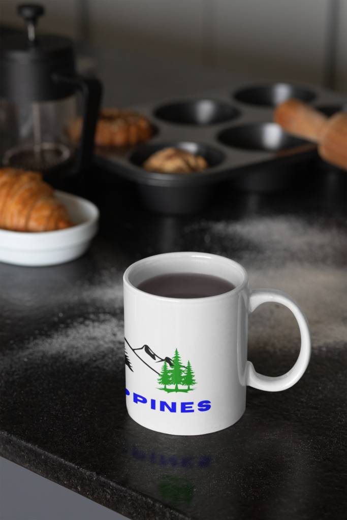 Philippines mountain mug on a dark kitchen counter with pastries, baking tools, and a cozy lifestyle setup